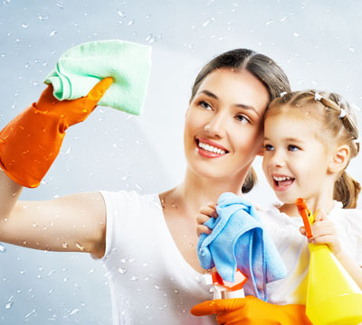 Smiling Mother and cute daughter does cleaning
