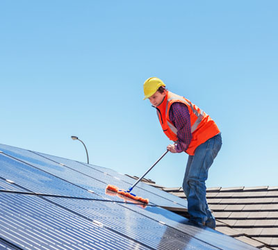 Male Cleaner performing office clean with mop